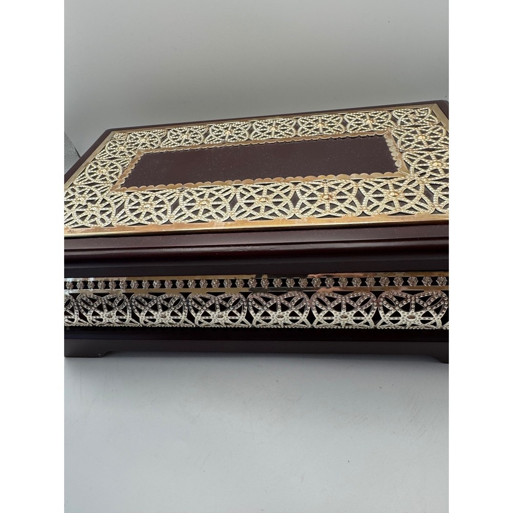 Elegant Wooden Jewelry Box with Ornate Metal Accents and Mirror